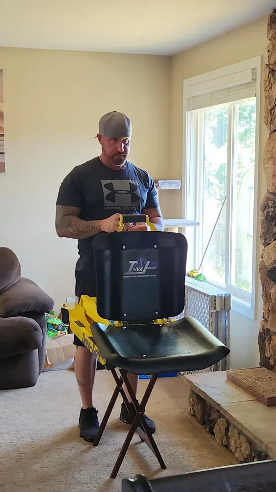 Kevin testing the seat of the yellow prototype at home