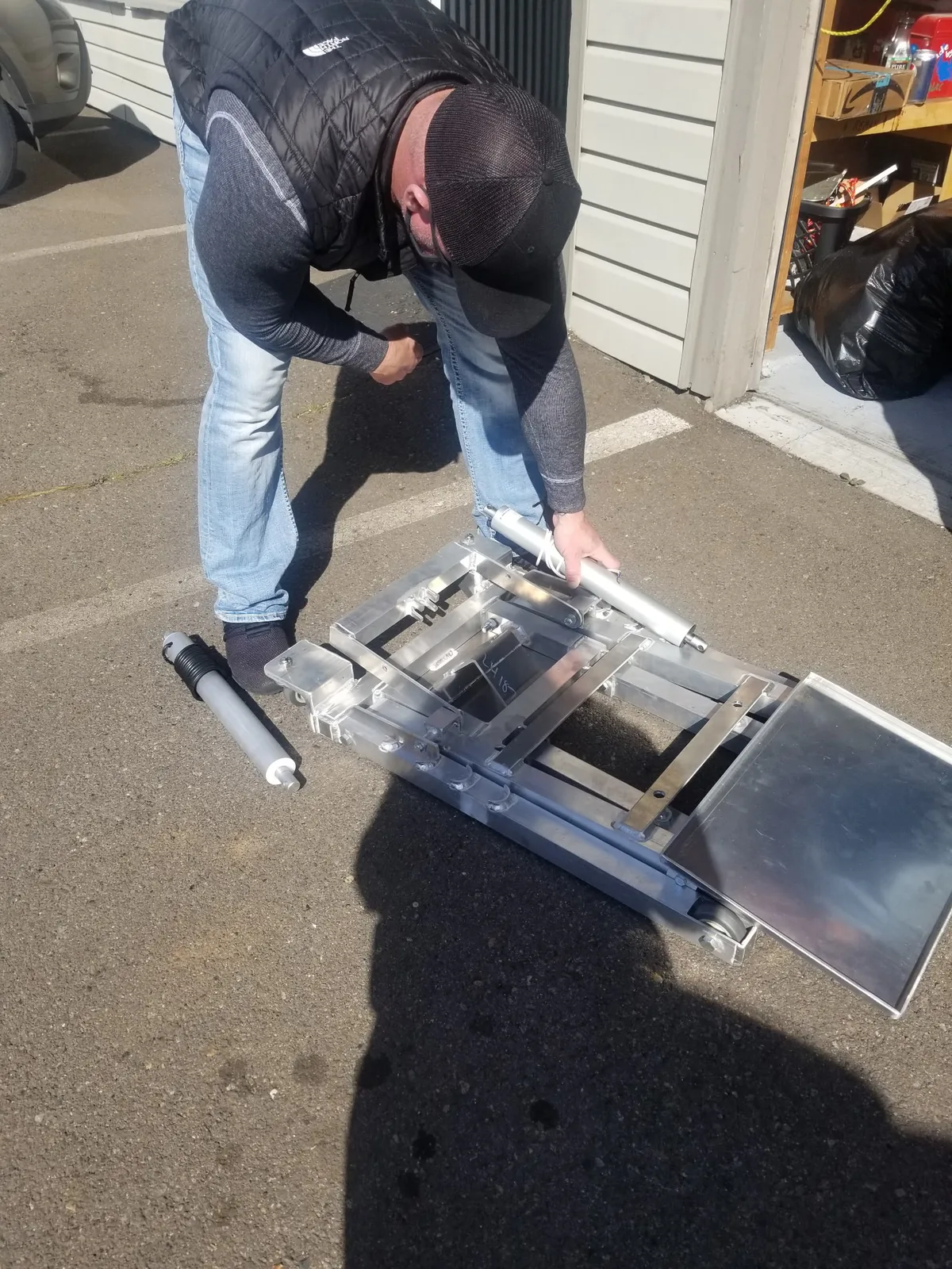 The first aluminum lift frame, laid out on a driveway